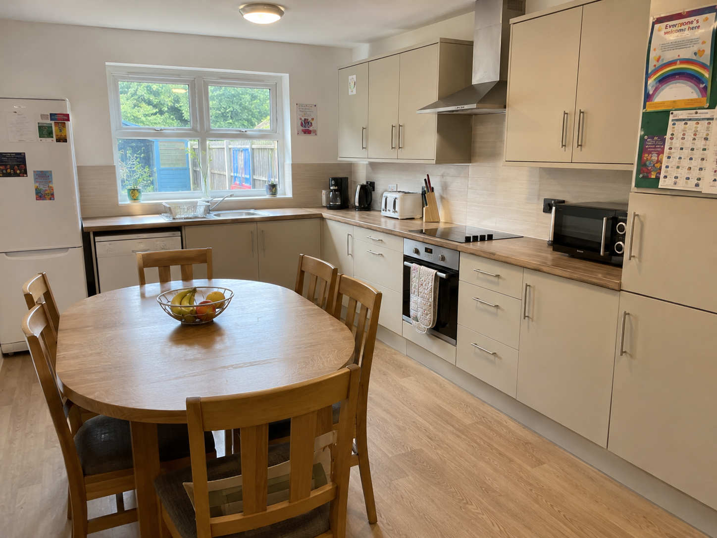 Bright care home kitchen and dining area